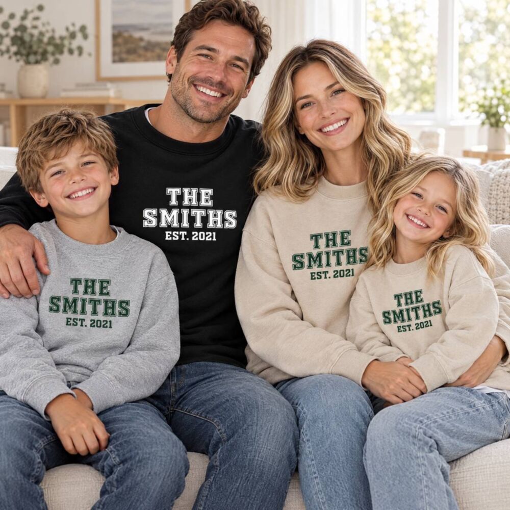 Family in matching personalised college sweatshirts reading “The Smiths est. 2021” Family in matching personalised college sweatshirts reading “The Smiths est. 2021”